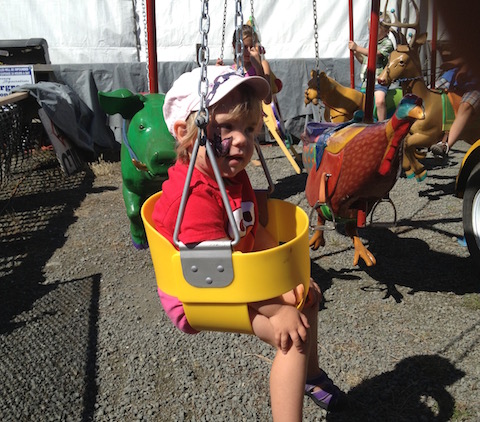 boy in bucket swing